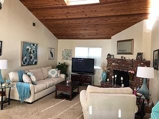 gorgeous beamed vaulted ceilings in the living room, dining