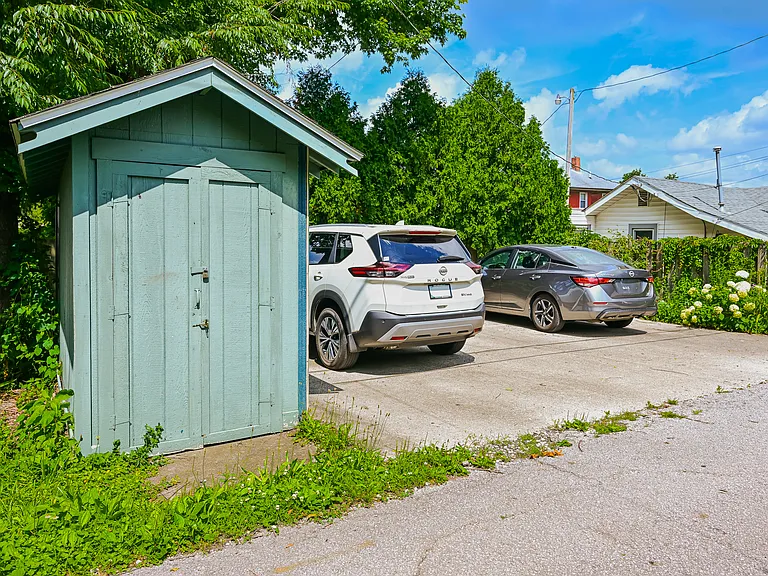Three car driveway in back of house