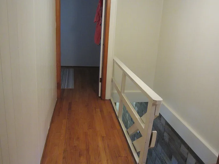 2nd floor hallway into larger bedroom