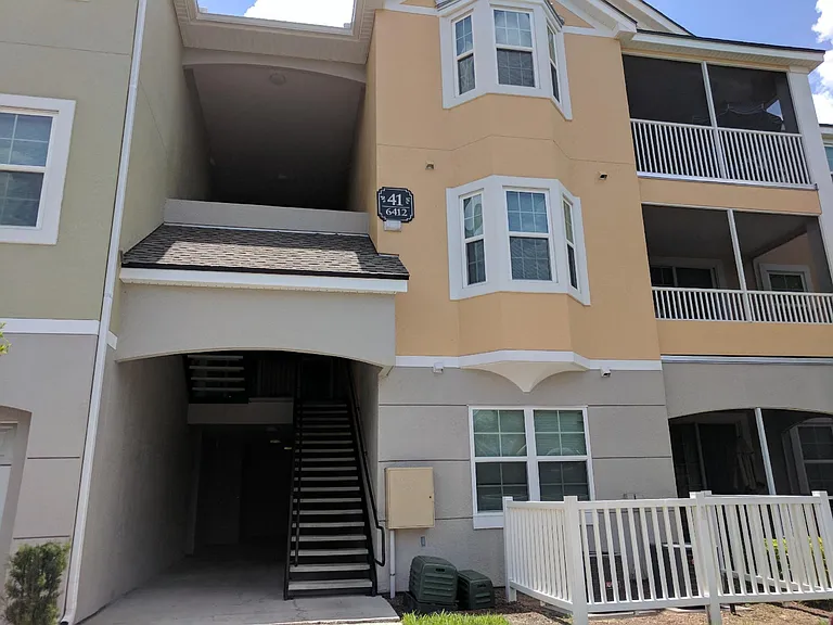 Right next to the community gate, providing convenient access while still within a gated community.