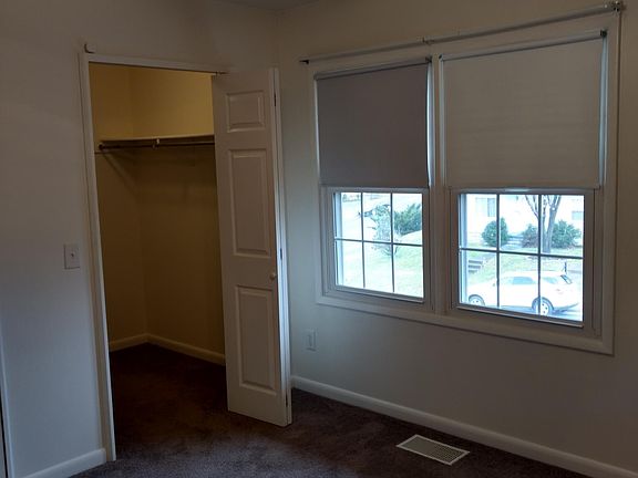 upstairs front bedroom with with walk in closet