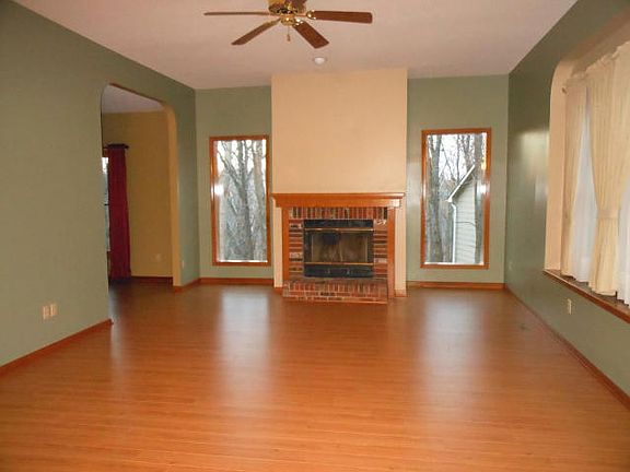 Living Room with Wood Burning Fireplace