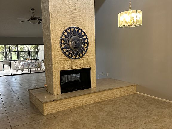 Dining room area with view of living room in background