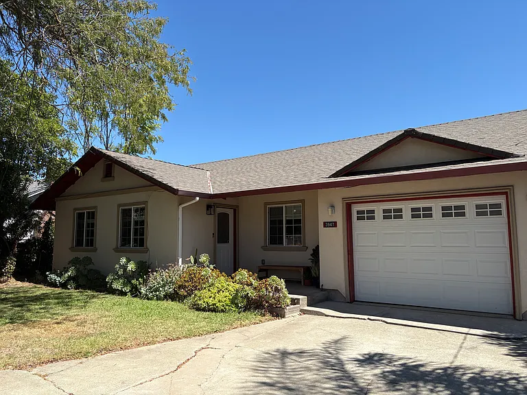 Front of house, one car garage