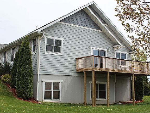 Back of home with deck