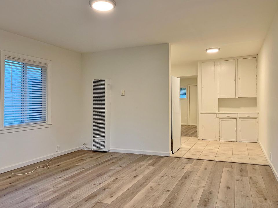 Living Room; stock photos. Available unit has luxury vinyl "wood" plank flooring throughout except in the bathroom.