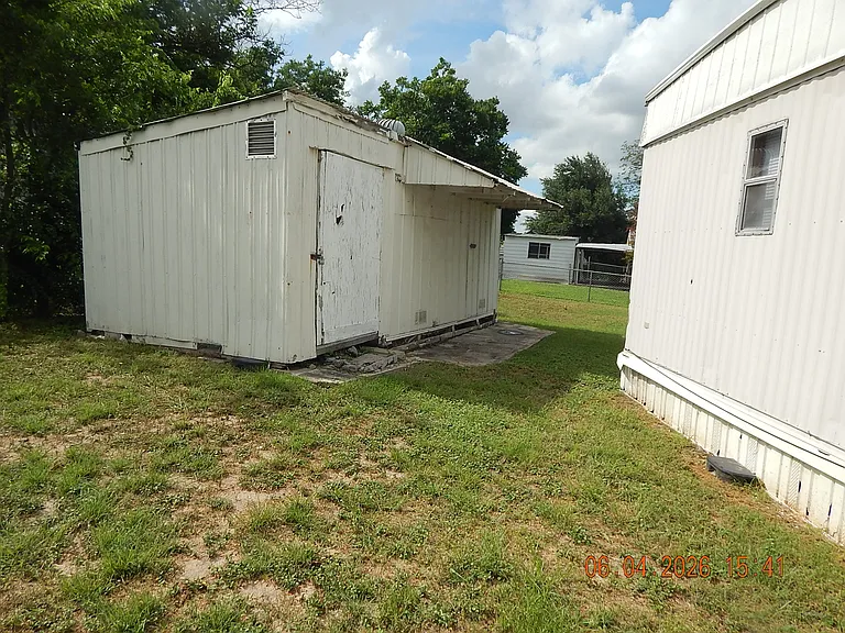 Storage building behind house