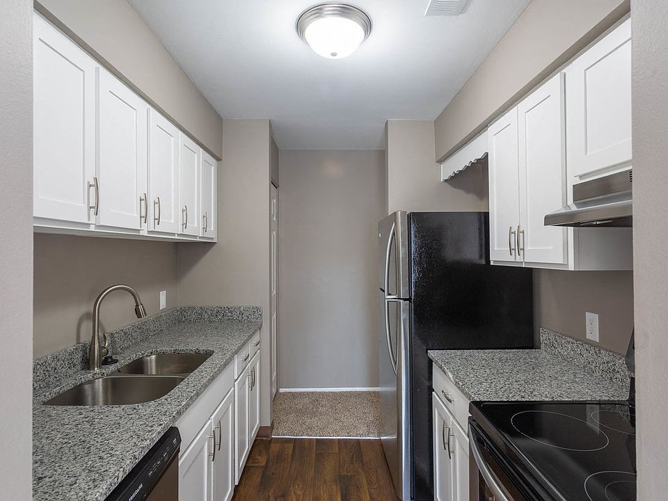 Galley-Style Kitchen With Stainless Appliances