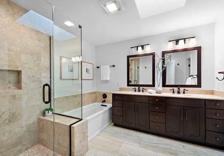 Bathroom with dual vanity, soaking tub, and walk-in shower_spacious and thoughtfully designed.