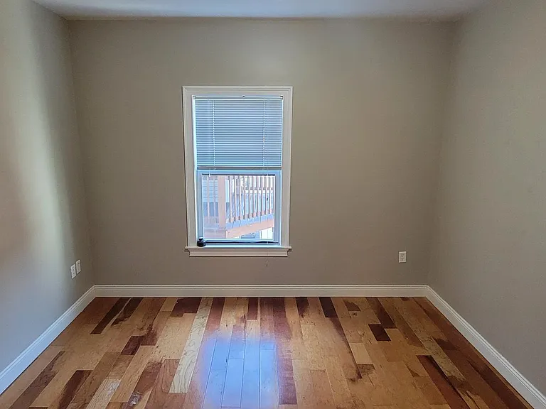 MIDDLE BEDROOM, WINDOW TO DECK/COURTYARD