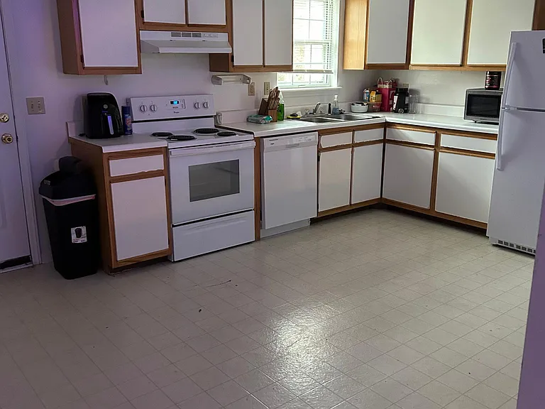 Large eat in kitchen, back entrance to patio and outdoor storage.