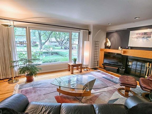 Living Room with natural fireplace, custom mantle and built-ins.