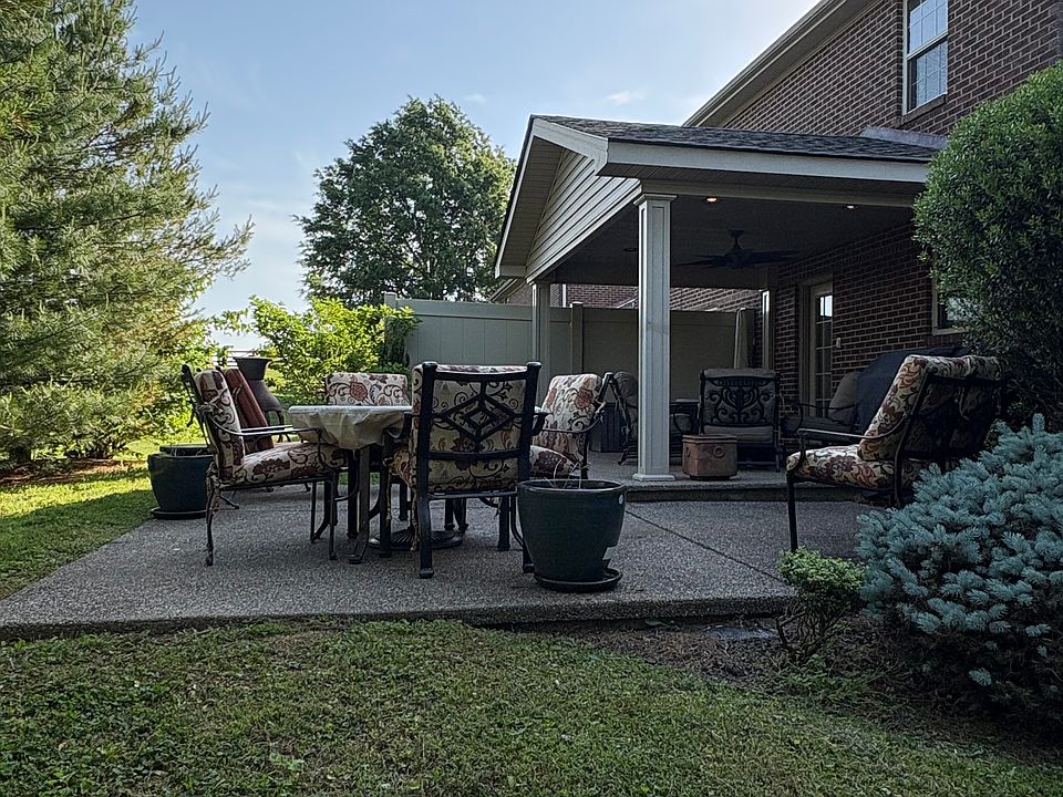 lush landscape covered patio and uncovered patio. Patio furniture not included or gilling equipment.