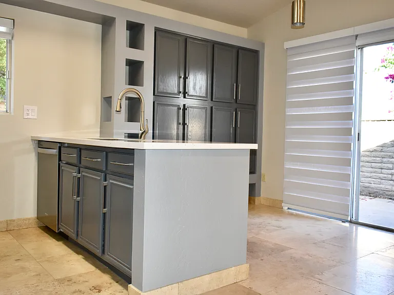 Kitchen and Dining Area - Lots of cabinet storage. Blackout retractable roller shades on all the windows - installed Aug 2024.