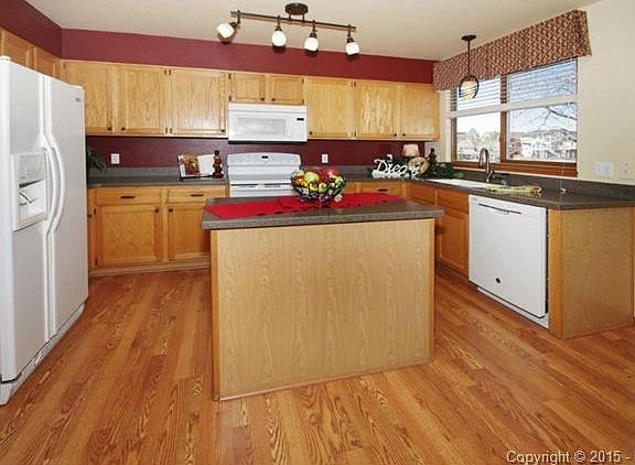 Kitchen with island and gorgeous hardwood floors
