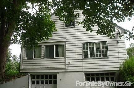 West gable end
						:
						Living room on right, glassed in porch on left, two car garage below
