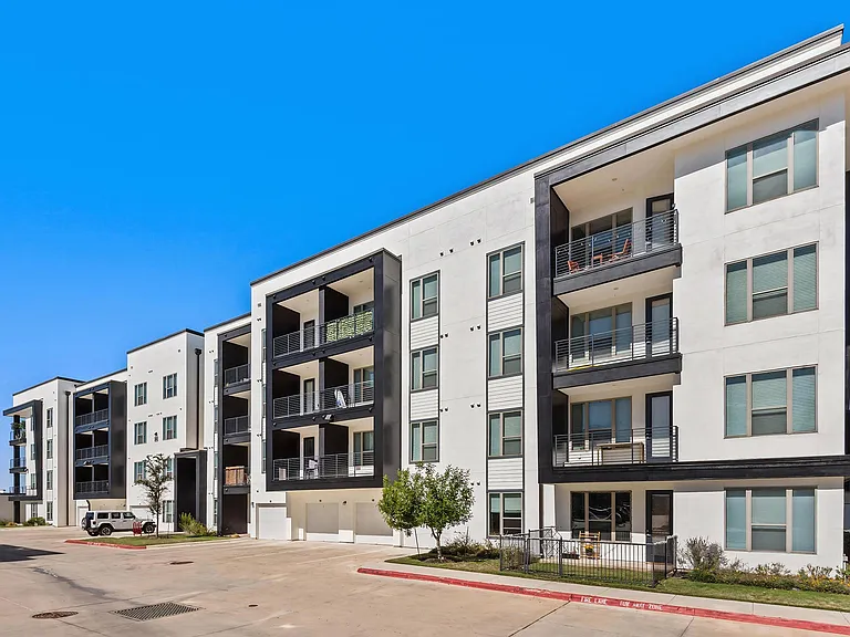 Rhythm Apartments Exterior Featuring Private Balconies and Garage Access