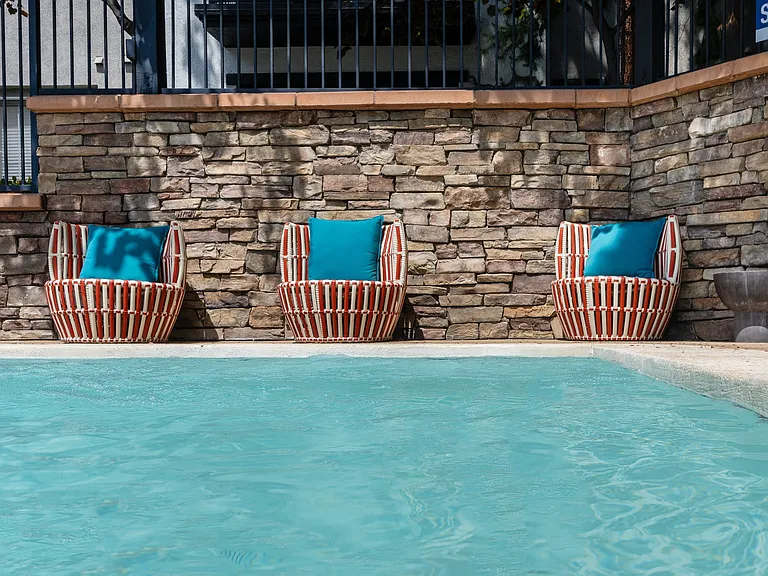 Poolside Seating at Resident Spa Featuring Colorful Cushions