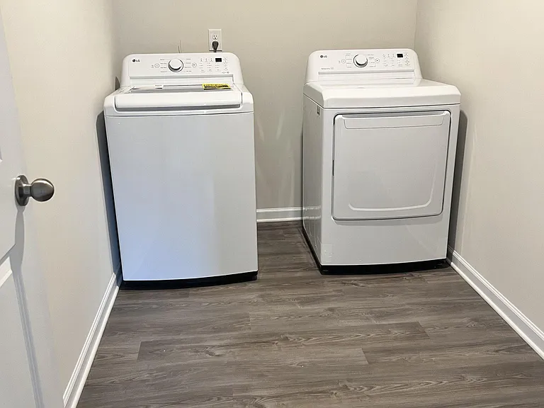 Washer dryer room with brand new LG appliances