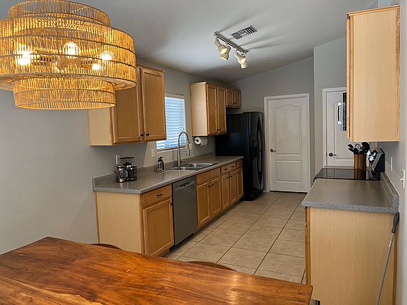 Maple cabinets and new stainless appliances, black fridge