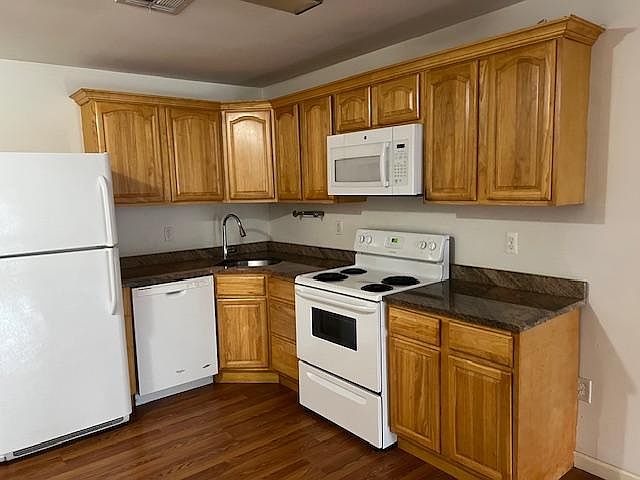 Kitchen with granite countertops and dishwasher