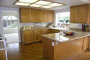 Kitchen - Granite countertops, eat-in bar & nook, bay window & hardwood floors