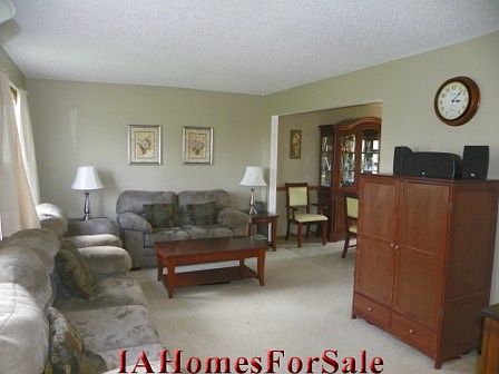 The living room has lots of natural light. All window treatments stay. 