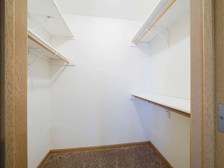 Step into convenience with our spacious walk-in closets, complete with ample shelving and racks for effortless storage.
