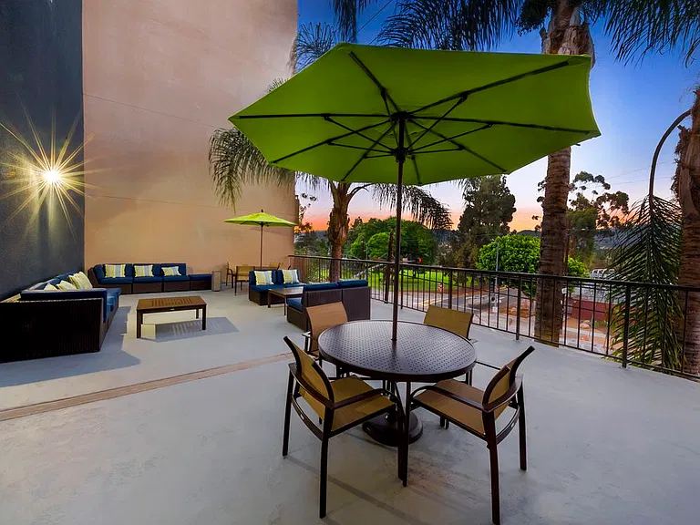 Resident courtyard with barbecue grills, fire pits, and lounge seating