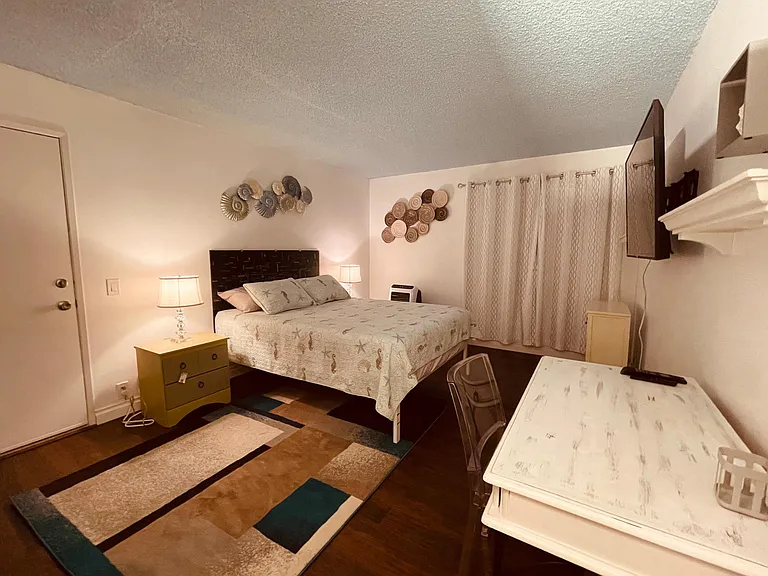 First bedroom suite with smart TV