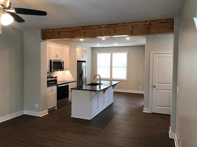 1st Floor open living front to back showing kitchen and Dining area.
