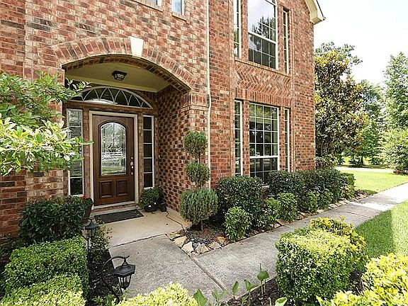 Impressive entry with mature landscaping provides great curb appeal and features country living at i