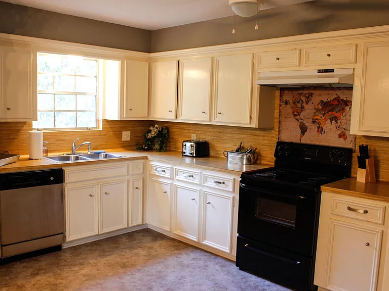 Fully stocked kitchen, with appliances, cookware, utinsils, dishes, toaster...