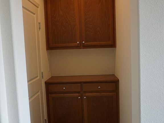 Custom cabinets at back door to garage