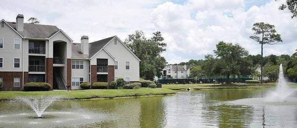Condo overlooks pond with fountains