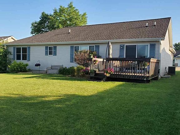 Back of house with deck off kitchen