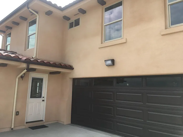 BACK ENTRANCE SHOWING 2 CAR GARAGE