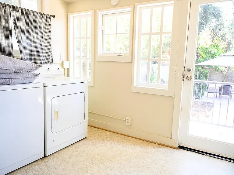 Laundry room looks out to backyard