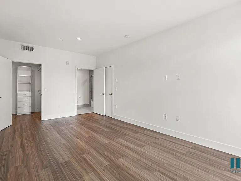 Bedroom with Walk-In Closet with Built-In Organizers