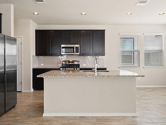 kitchen with granite countertops and stainless steel appliances