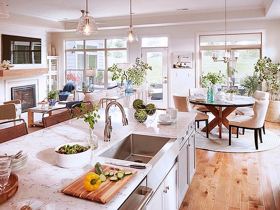 A view of the kitchen island in the Torino model, looking out to the living and dining areas.