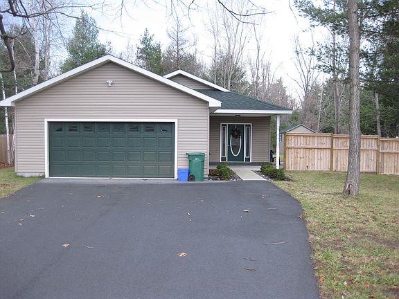garage double wide black top driveway