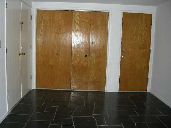 Formal entry with guest closet and door with direct access to garage