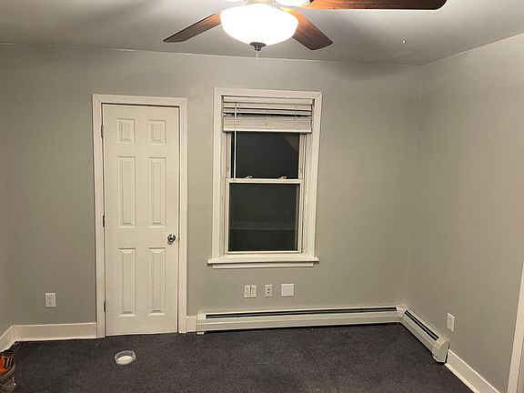 This photo is from the back of the living room. The door shown is a second exit as well as closet space.