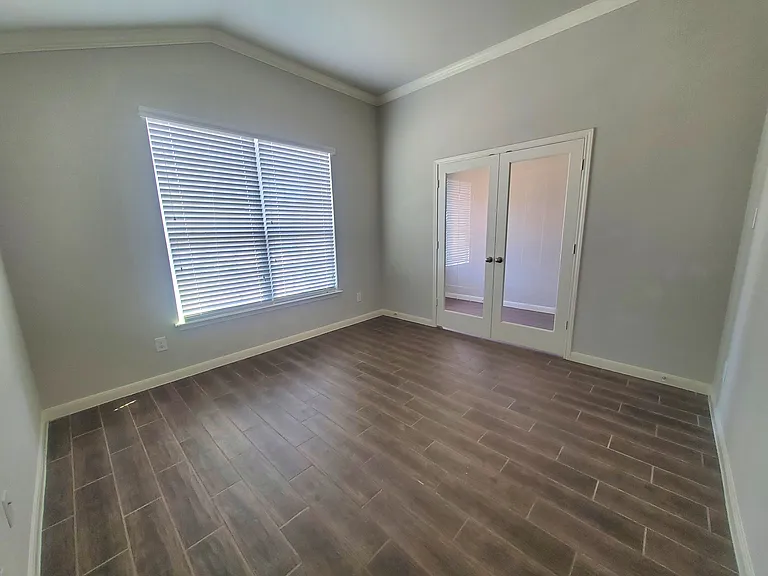office with french doors and crown moulding