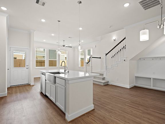 Kitchen with stainless steel apron-front sink