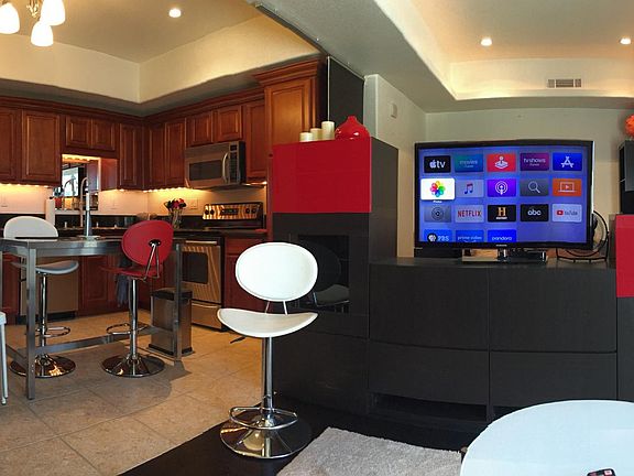 Dramatic custom lighting, big screen & Apple TV box included.