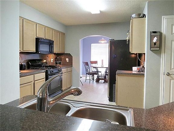 This central kitchen has a gas range!