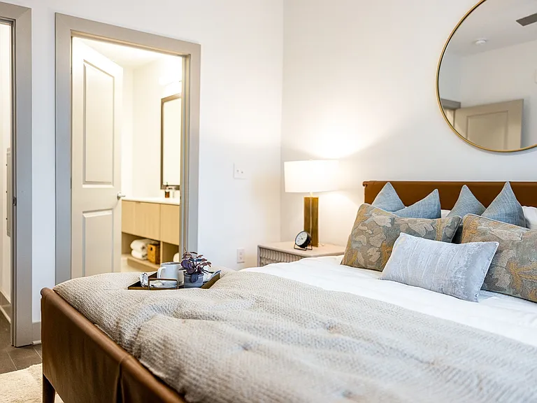 Inviting bedroom with ensuite and elegant decor.