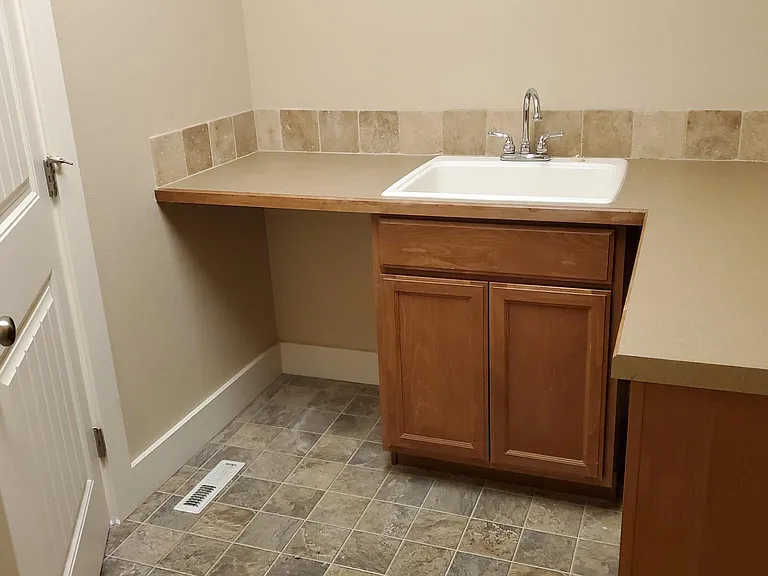 Large laundry room with sink